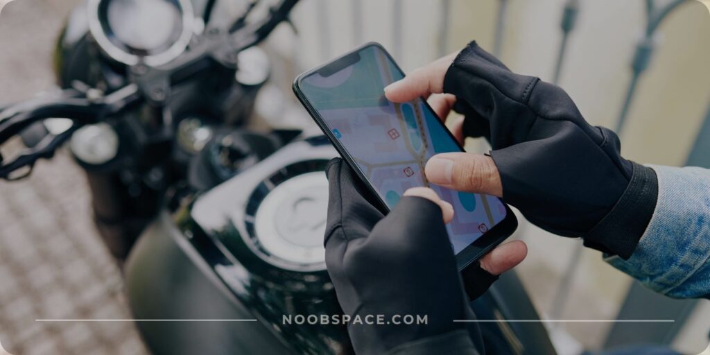 A biker using his Android smartphone to zoom in on a map app for navigation purpose