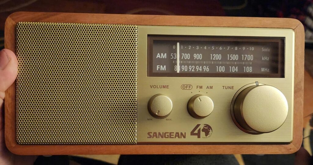 A photo of front view of Sangean WR-11 AM and FM radio