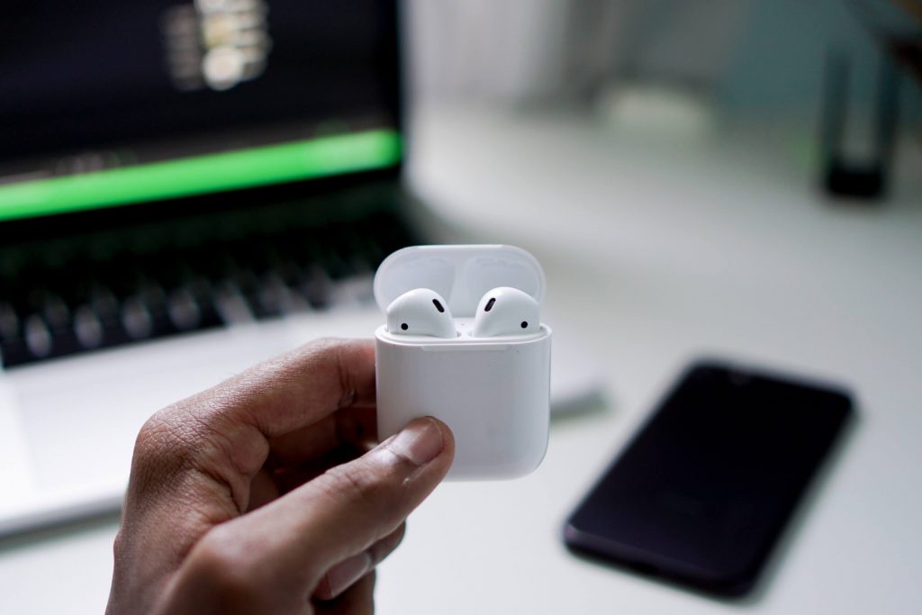 How to Clean Your Phone From Germs and Viruses 4 A person holding Apple AirPods case in hands