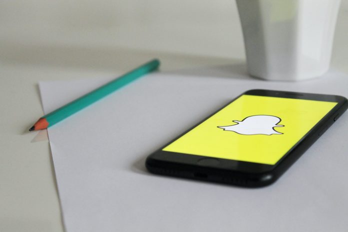snapchat-phone-photo A phone with Snapchat logo on a table
