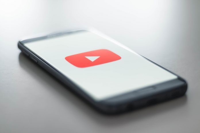 download-youtube-on-any-device Download YouTube logo on a smartphone